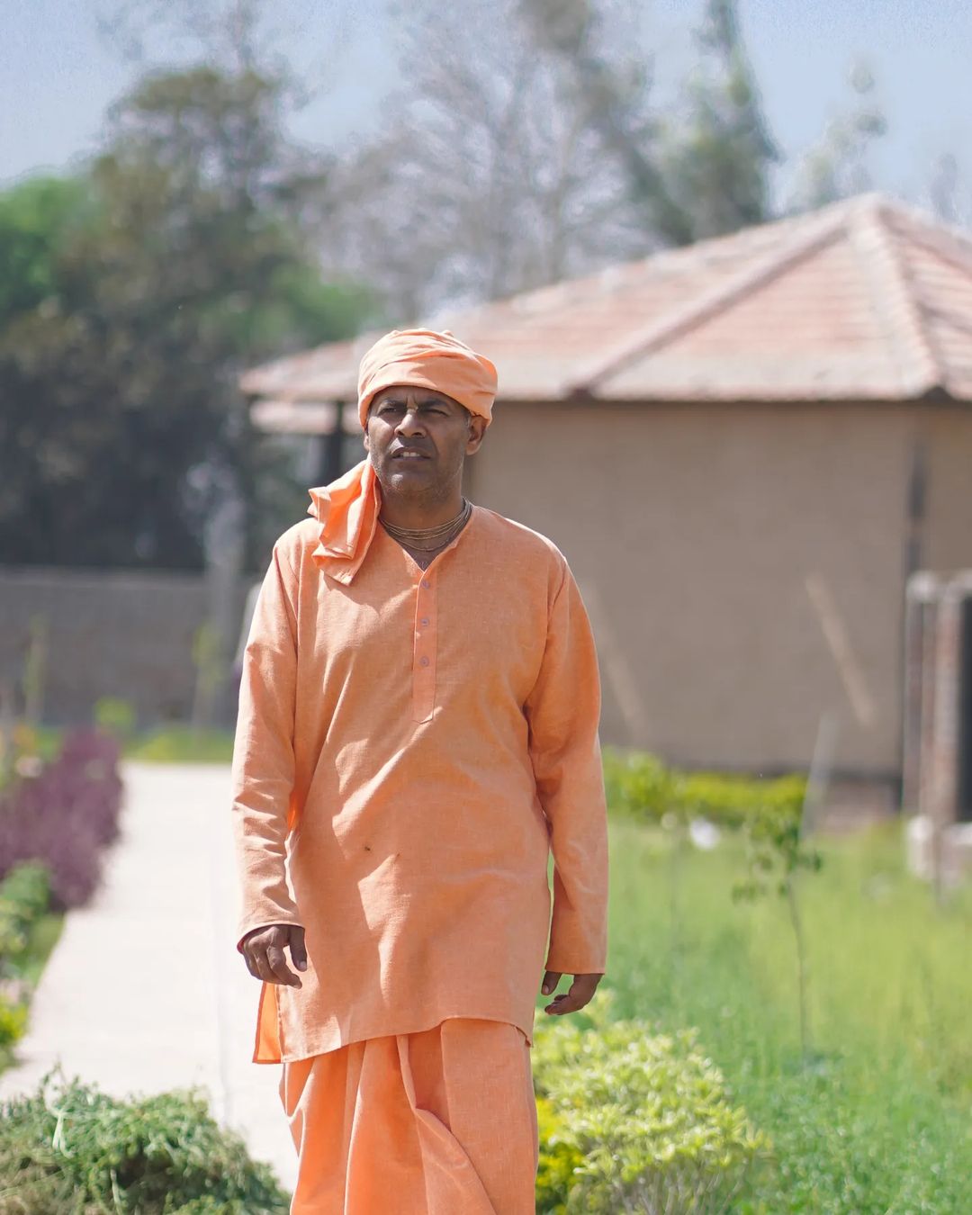 Dr. Keshav Anand Das walking through the ashram